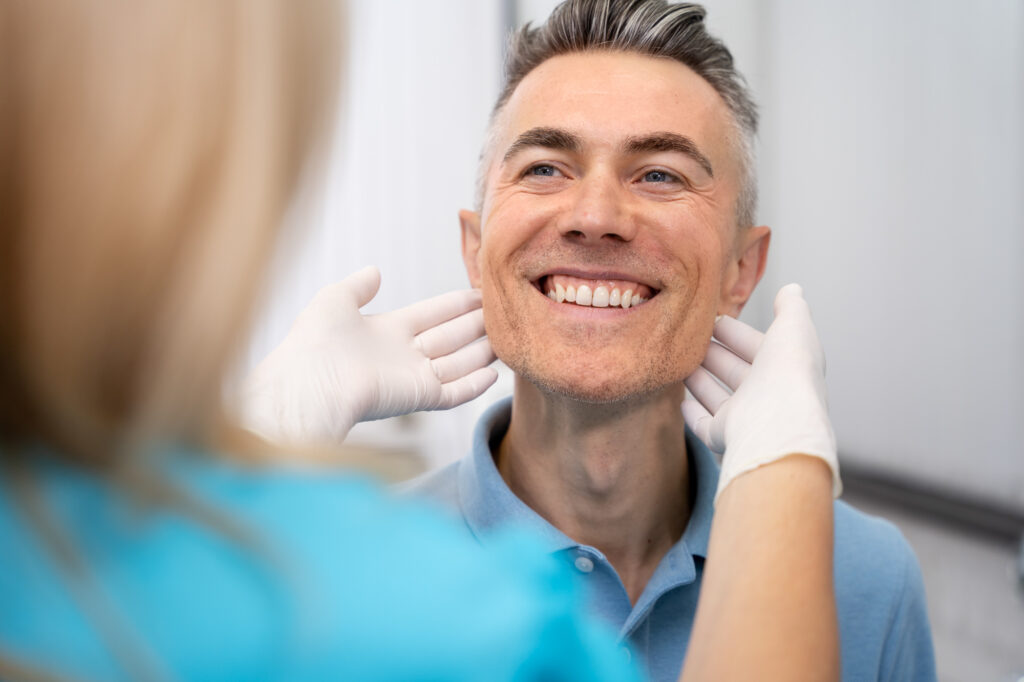 A provider at Medical Grade Aesthetics conduction an physical exam before talking about BHRT near Freeport.