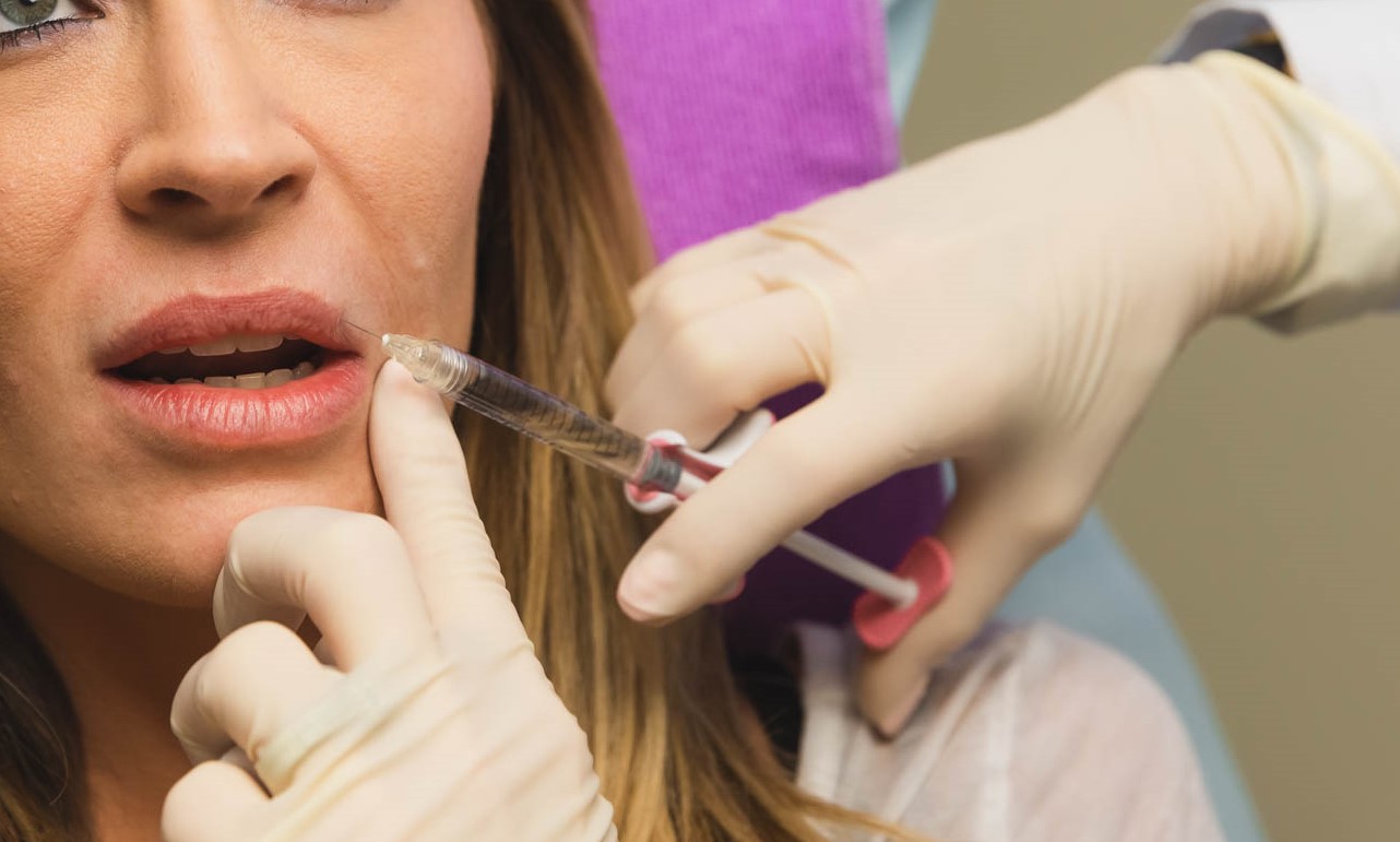 A Medical Grade Aesthetics client receives Botox and lip filler in Freeport.