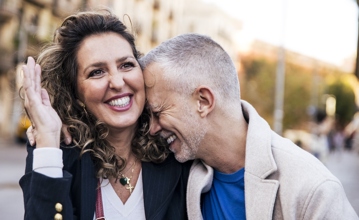 A mature couple smiles together after receiving hormone replacement therapy in Beloit