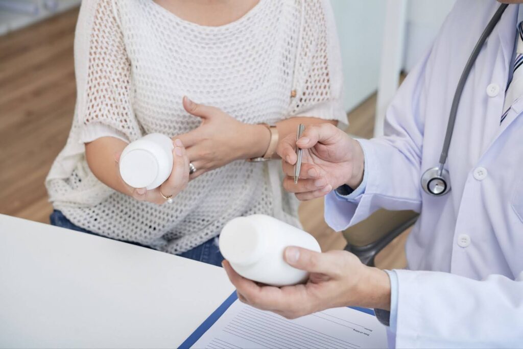A doctor shows a female patient her medication options to enhance her results from News flash—hormone therapy isn’t just for menopausal women anymore! Your hormones are a lot more important than you may think, essentially making you, you. For both men and women, your hormones determine your: Energy levels Libido Mood Weight Muscle mass Skin, hair, and nail health From puberty well into adulthood, your hormones are constantly changing. That means that even the smallest change can have big implications. At Medical Grade Aesthetics, we’re simplifying this never-ending balancing act with bioidentical hormone replacement therapy (BHRT). Beyond boosting your mental health, this innovative treatment also increases your metabolism, regulates your appetite, and controls the digestive process, playing a big role in your diet (and therefore weight loss). Some patients’ treatment plans combine BHRT with Emsculpt NEO near Janesville, streamlining their physical transformation. → Learn more about recognizing the signs of a hormonal imbalance Emsculpt NEO near Janesville