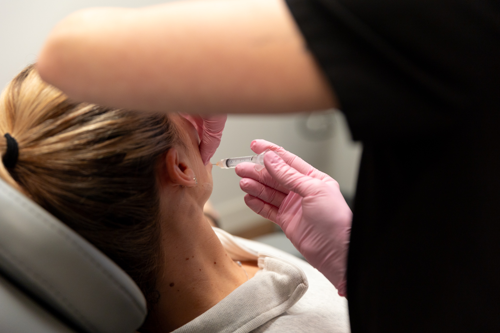 A Medical Grade Aesthetics provider administers Sculptra as part of the patient's facial balancing in Beloit.