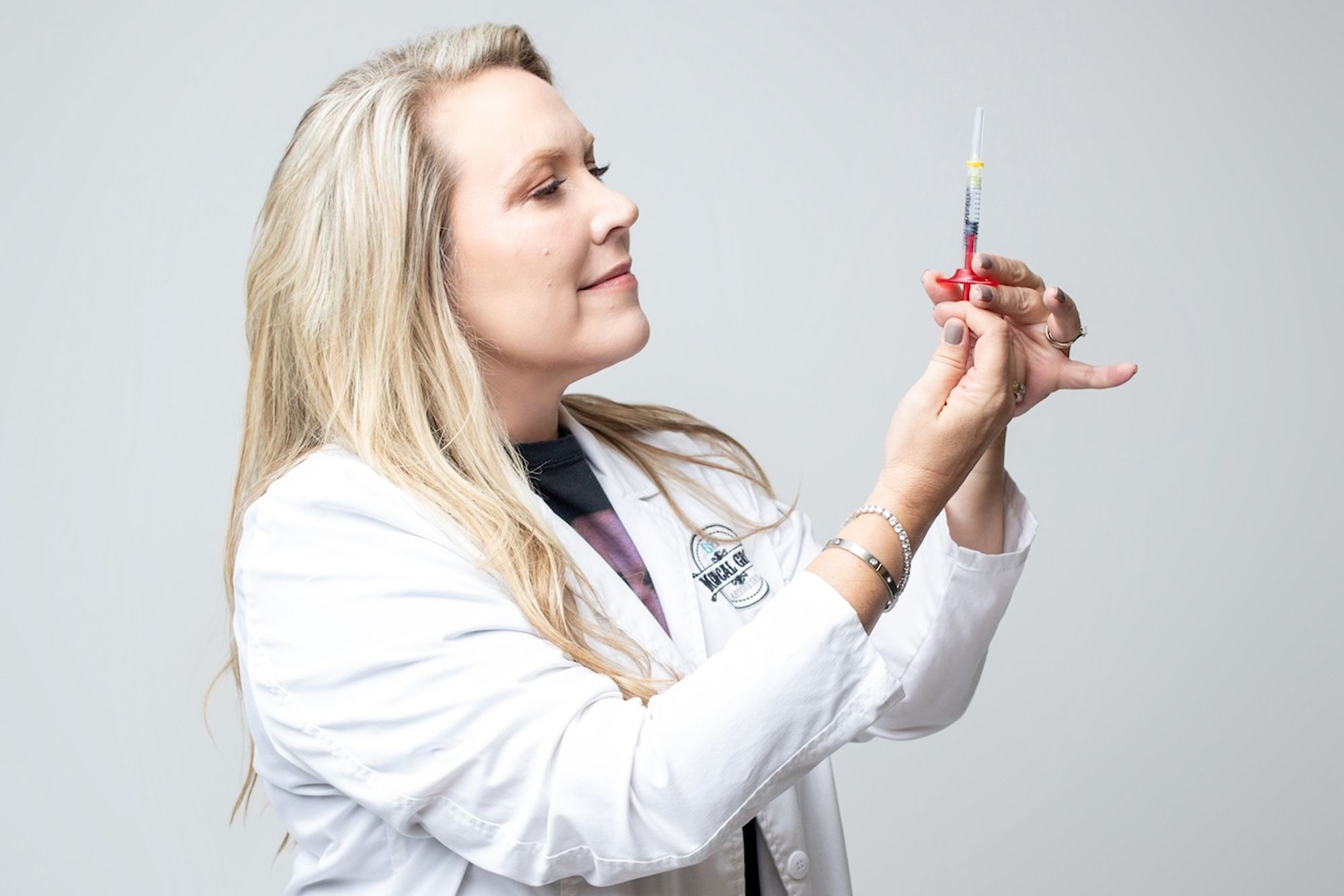 Dr. Jen Yeager holds a syringe as she prepares to administer Dysport in Freeport.