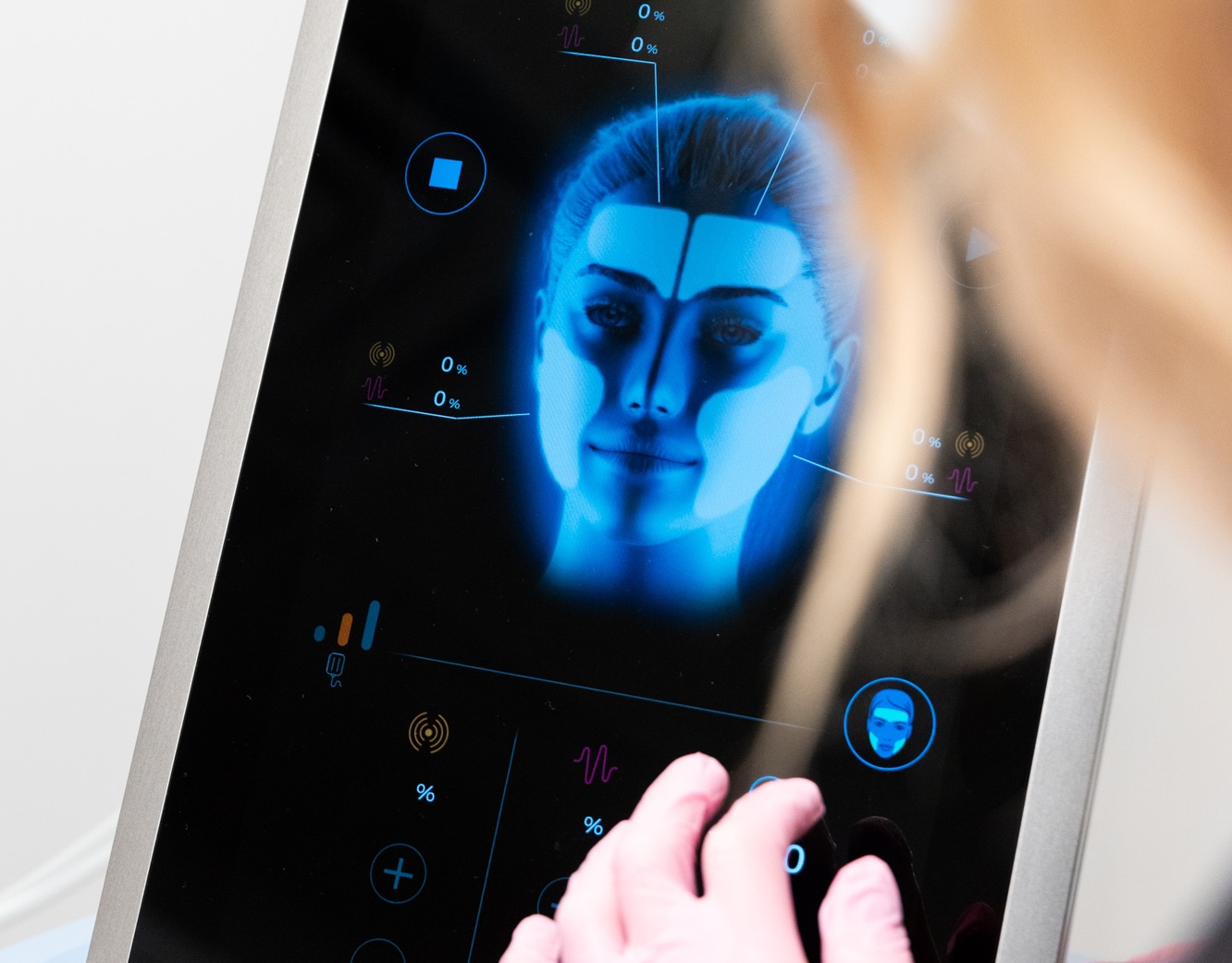 A provider modifies the device settings for a patient's custom EmFace near Freeport.