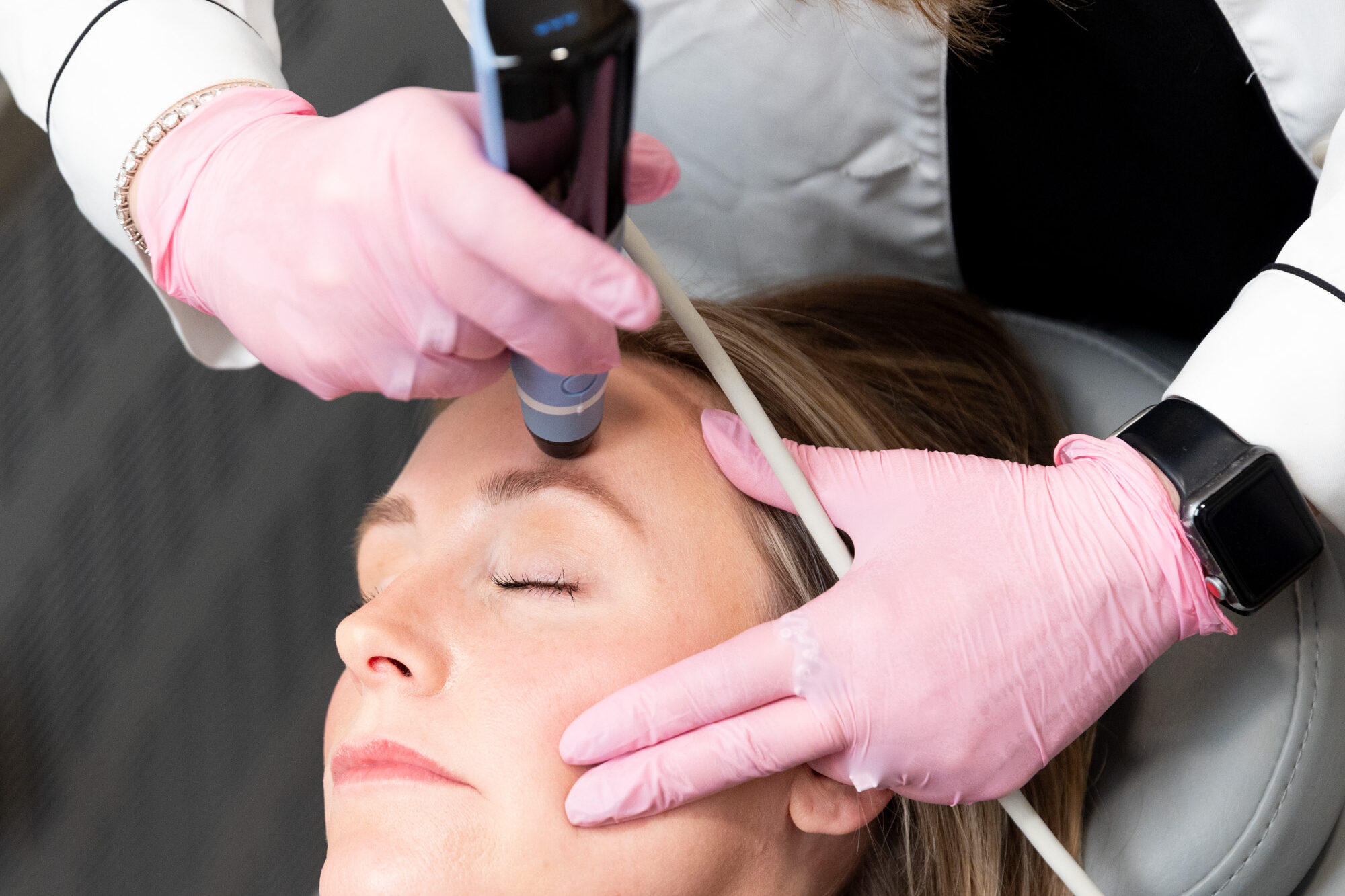 A Medical Grade Aesthetics practitioner applies the Exion Face device in a treatment often used to complement dark spot removal near Freeport.