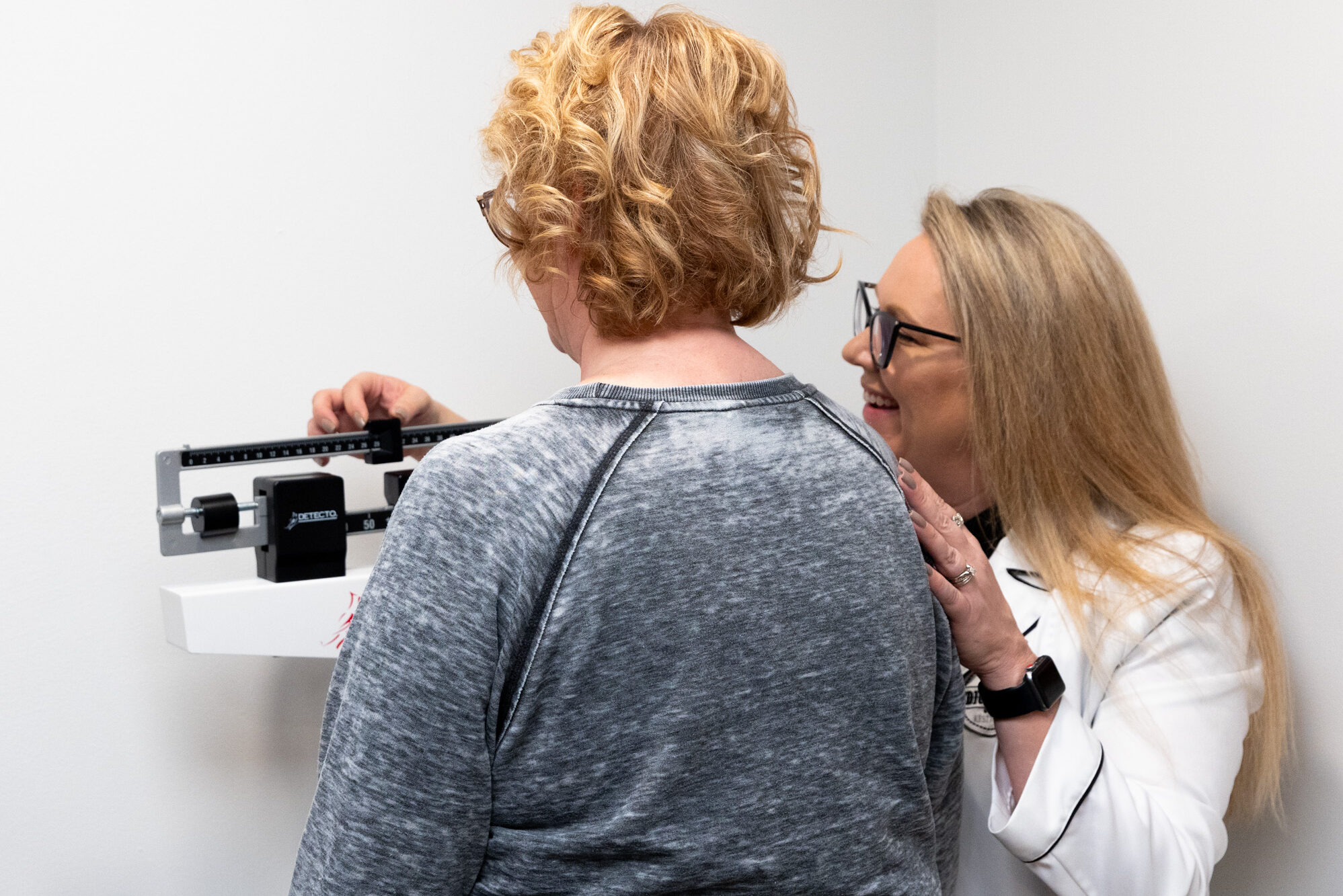 A patient undergoes a physical examination during her consultation for treatment for fatigue in Freeport.