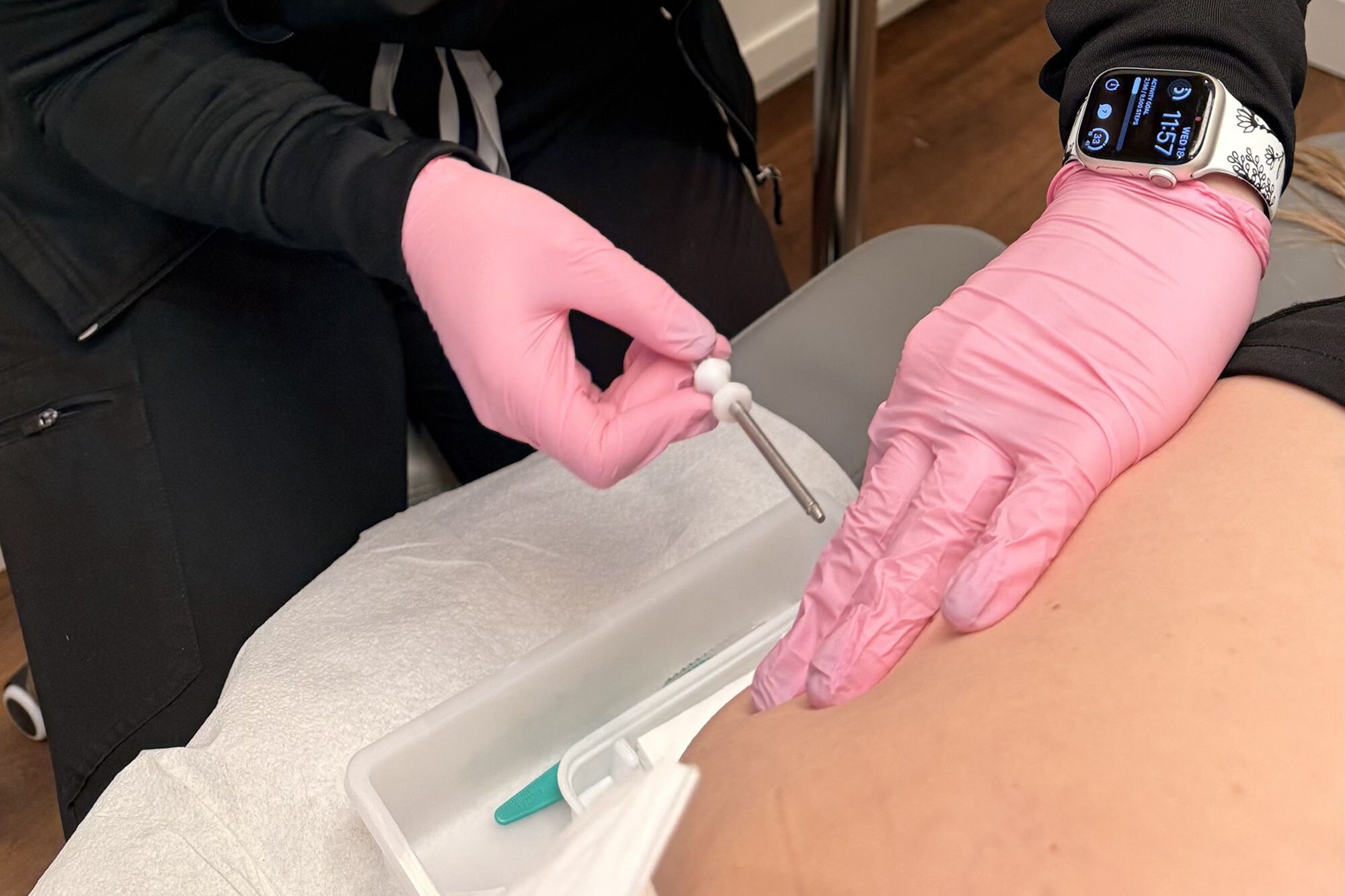 A Medical Grade Aesthetics provider expertly places a patient's hormone pellet as part of her treatment for fatigue in Freeport.